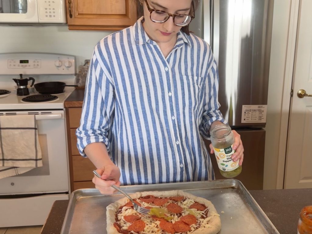 adding pizza toppings