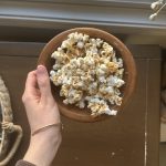 a bowl of healthy caramel popcorn